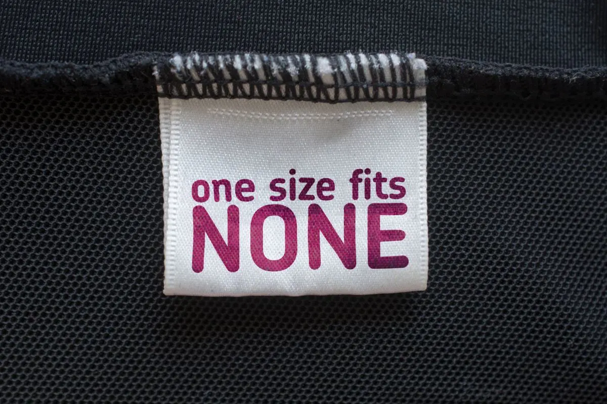 A cloth tag written one size fits none, a mockery of All Size